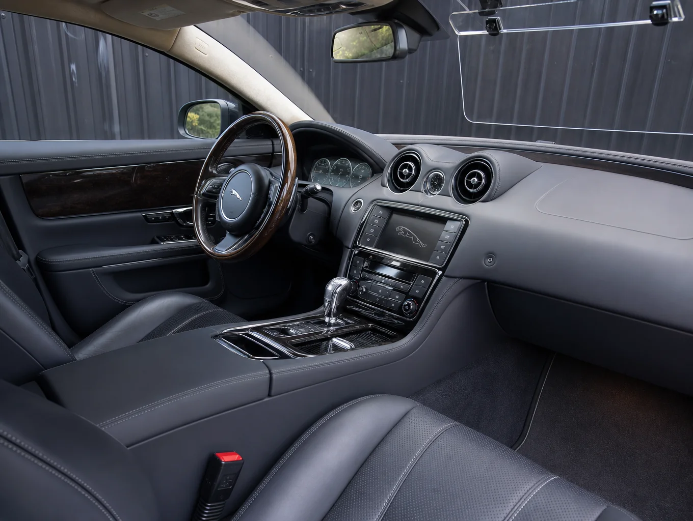 Meticulously detailed luxury vehicle interior cockpit with conditioned leather and clean dashboard
